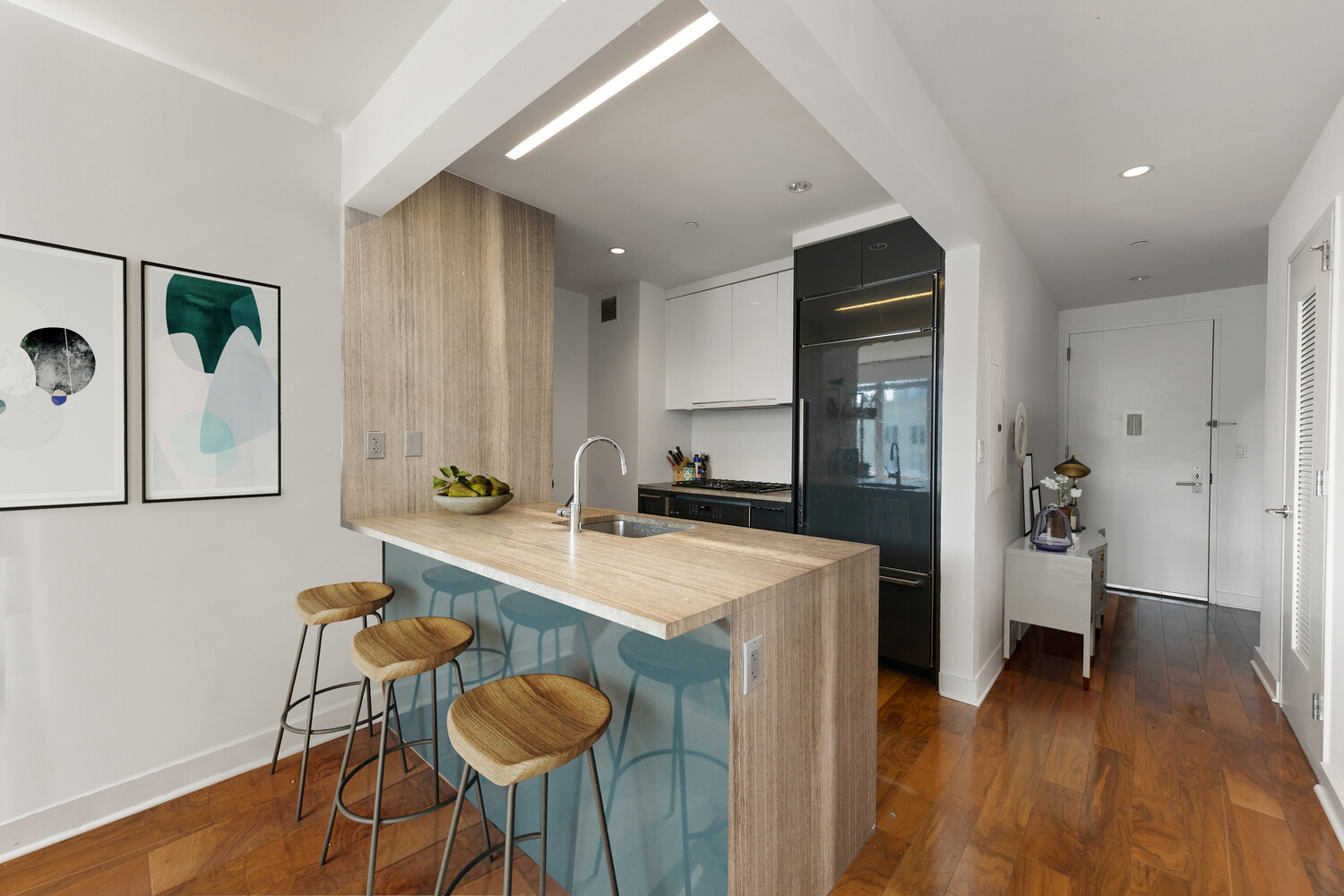 2 Northside Piers, Unit 7D Brooklyn, NY 11249 - Photo 12 of 17 a kitchen with stainless steel appliances granite countertop a sink and a refrigerator