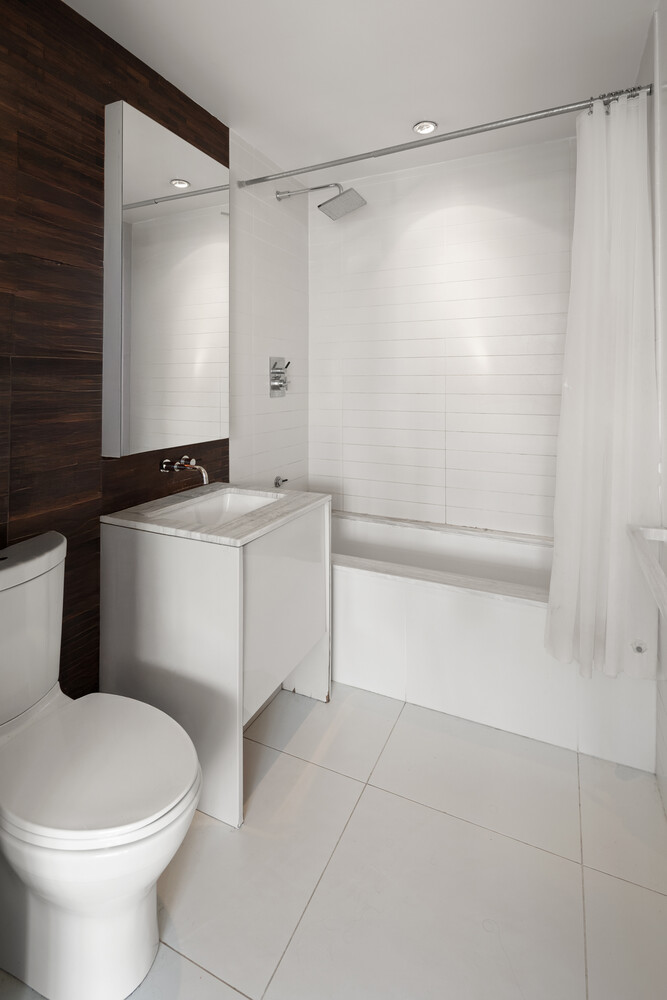 2 Northside Piers, Unit 7D Brooklyn, NY 11249 - Photo 13 of 17 a bathroom with a sink a toilet and shower