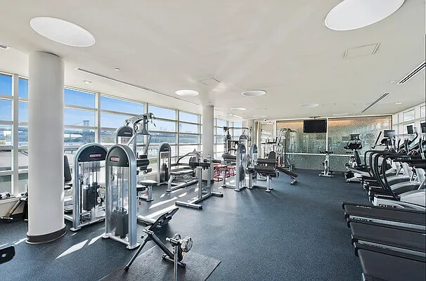 2 Northside Piers, Unit 7D Brooklyn, NY 11249 - Photo 15 of 17 a view of a room with gym equipment