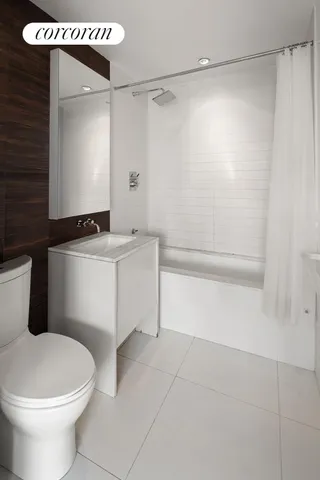 a kitchen with stainless steel appliances granite countertop a sink and a refrigerator