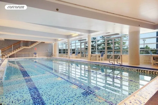 a bedroom with a large bed and a large window