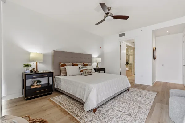 a bedroom with a bed and a dresser