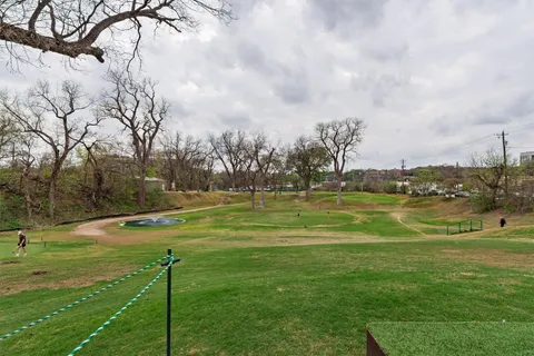 a view of a park with swings and slides