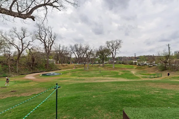 a view of a park with swings and slides