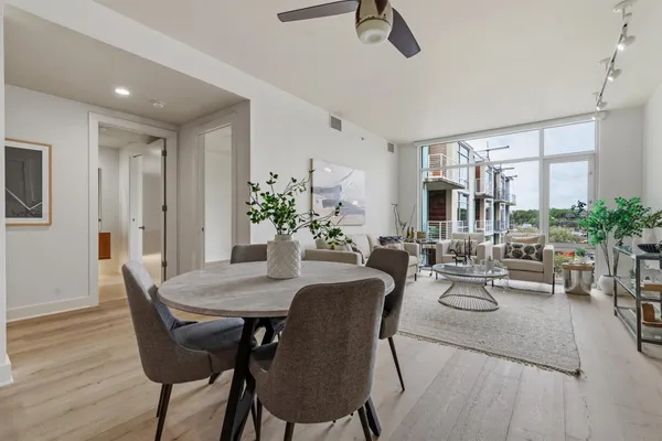 a view of a dining room with furniture and window