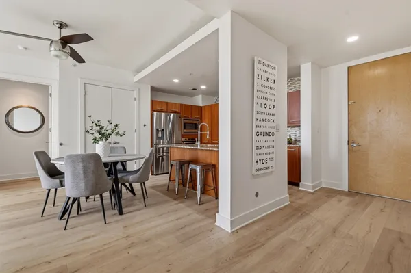 a view of a dining room with furniture and wooden floor