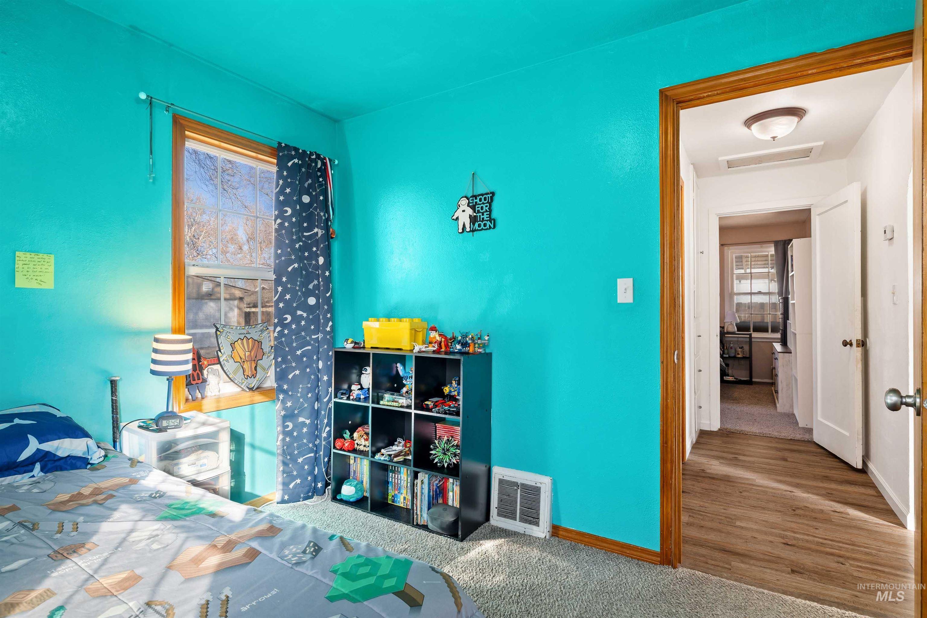 753 Ash Street Twin Falls, ID 83301 - Photo 18 of 25 Carpeted bedroom featuring baseboards and attic access