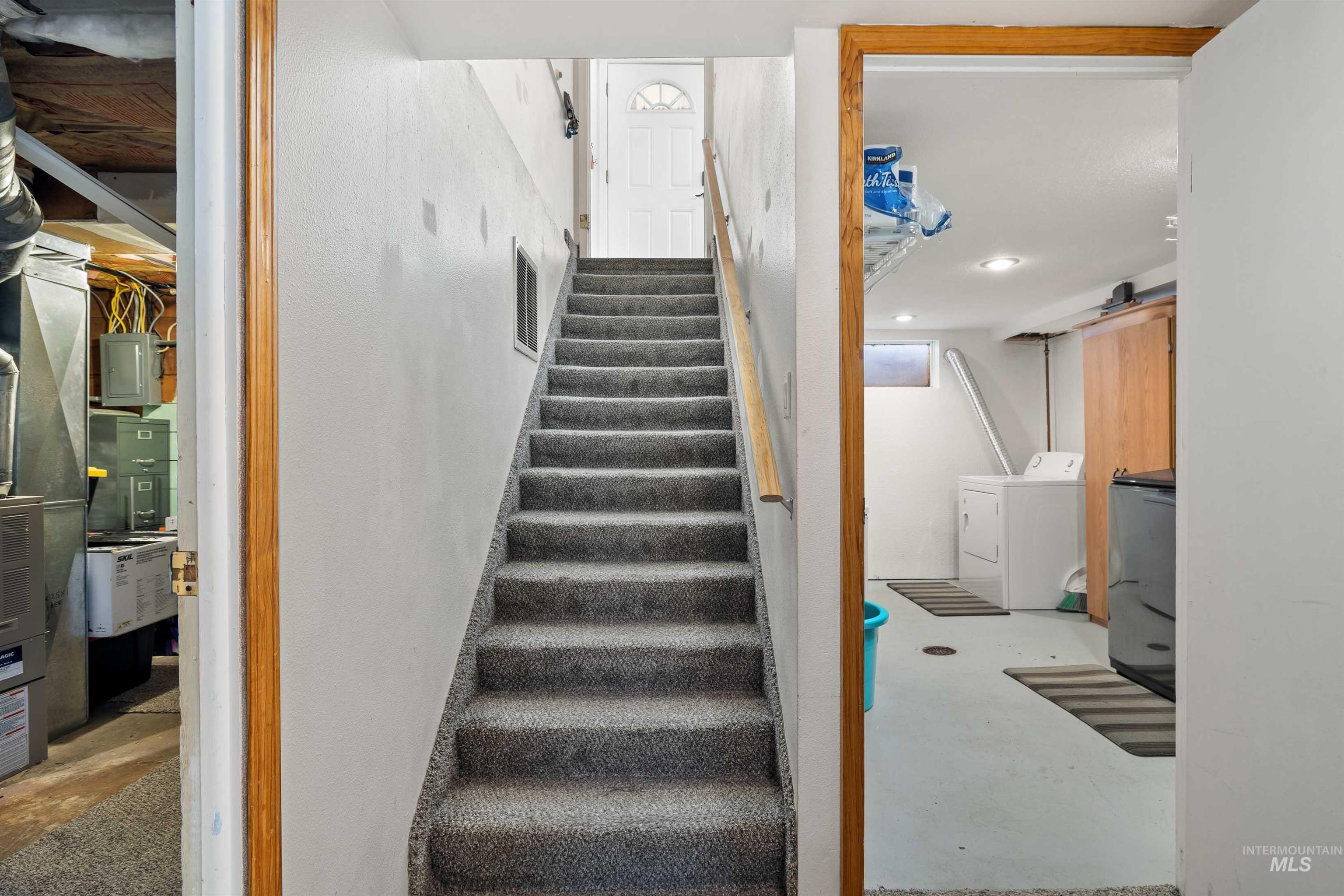 753 Ash Street Twin Falls, ID 83301 - Photo 19 of 25 Stairs featuring concrete floors, electric panel, washing machine and dryer, heating unit, and recessed lighting