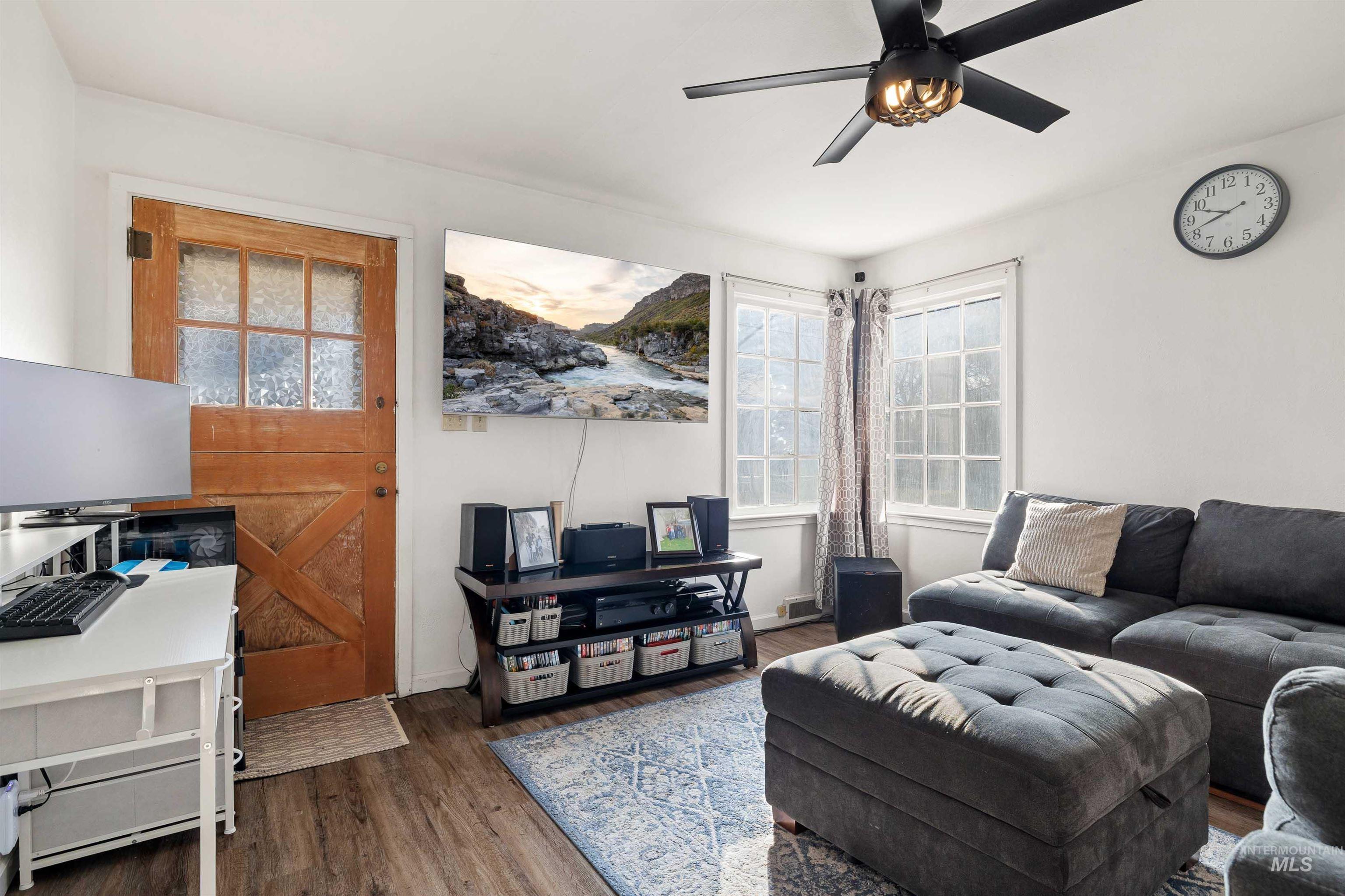 753 Ash Street Twin Falls, ID 83301 - Photo 4 of 25 Living room featuring wood finished floors and ceiling fan