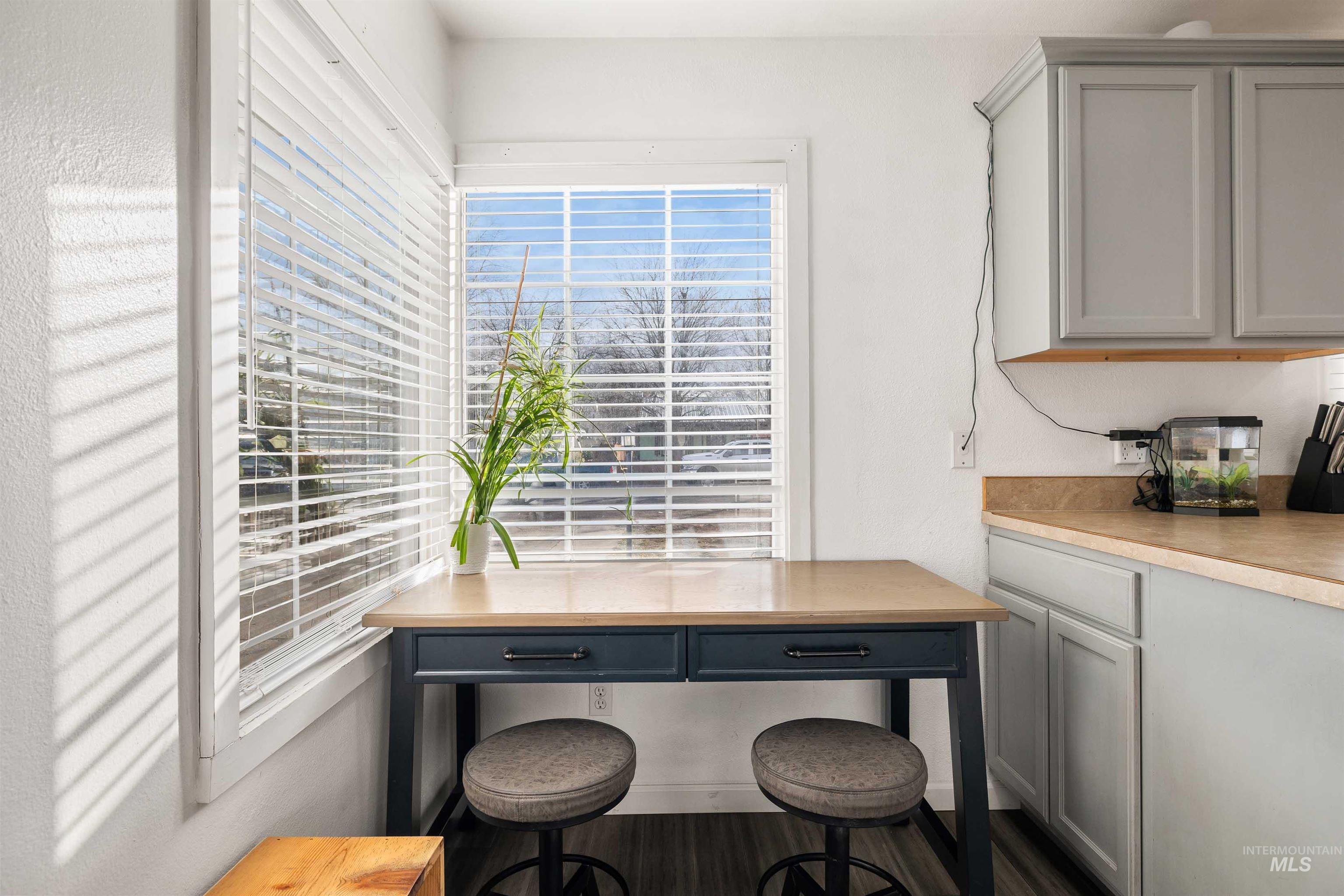 753 Ash Street Twin Falls, ID 83301 - Photo 9 of 25 Kitchen featuring gray cabinetry, light countertops, and dark wood-style floors