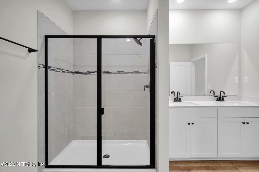 718 Morgans Treasure Road St. Augustine, FL 32084 - Photo 6 of 9 a bathroom with a shower and a sink