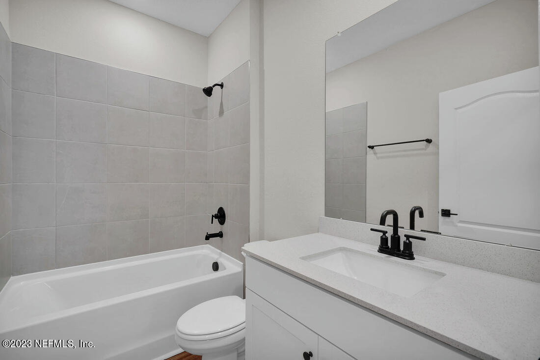 718 Morgans Treasure Road St. Augustine, FL 32084 - Photo 8 of 9 a bathroom with a sink a toilet and a bathtub