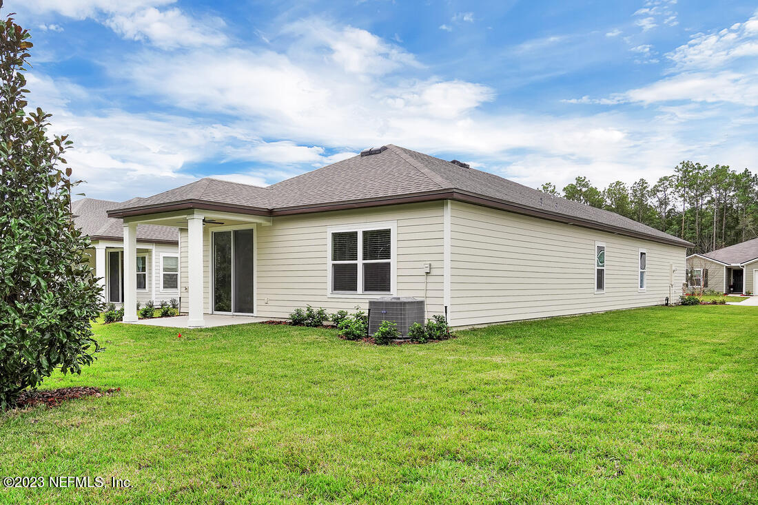 718 Morgans Treasure Road St. Augustine, FL 32084 - Photo 9 of 9 a view of a house with a yard