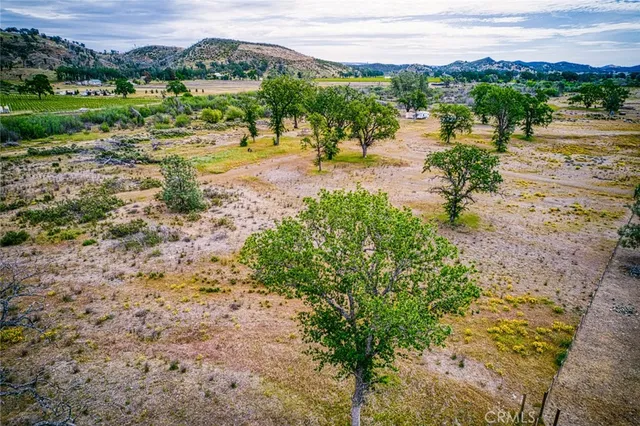 a view of a lake with houses in the back