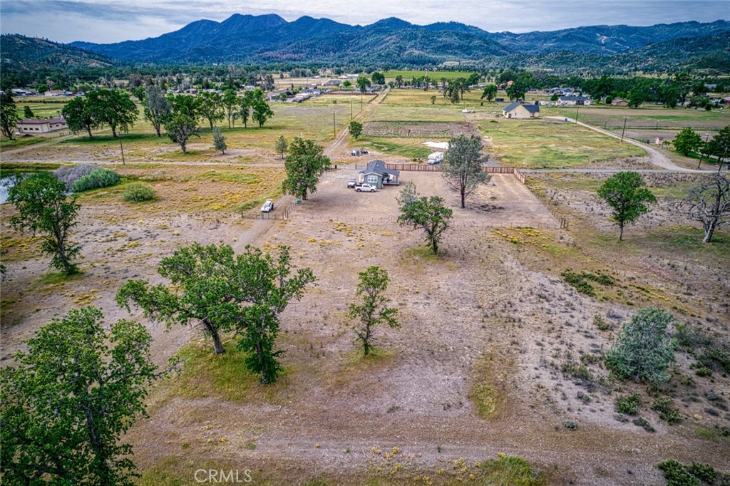 20553 Santa Clara Road Middletown, CA 95461 - Photo 8 of 10 a view of a lake with a yard and a large window