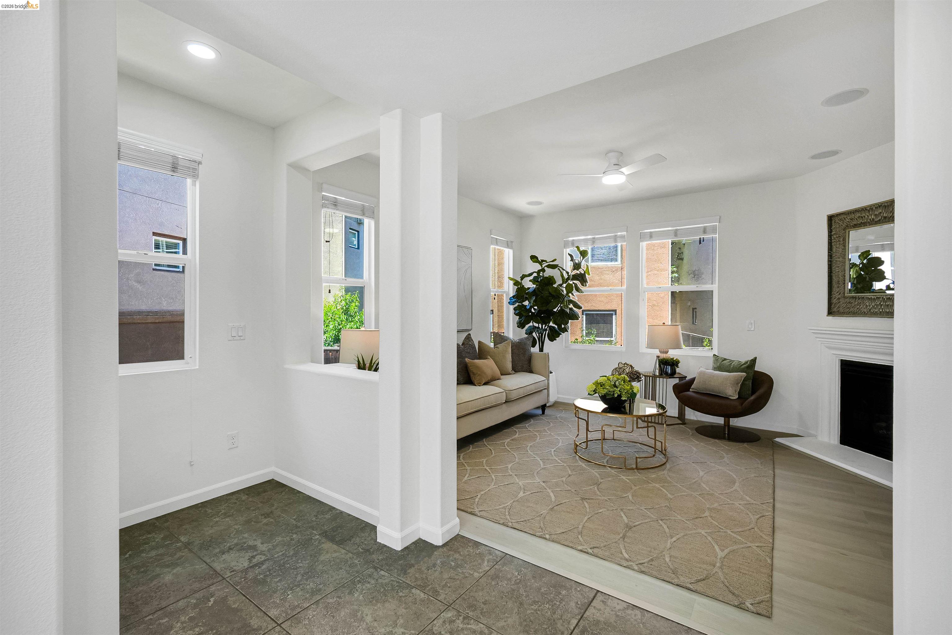 449 Constantine Court San Ramon, CA 94583 - Photo 14 of 63 Living space featuring recessed lighting, multiple windows, a ceiling fan, a fireplace with a mantel, and light wood-finish flooring