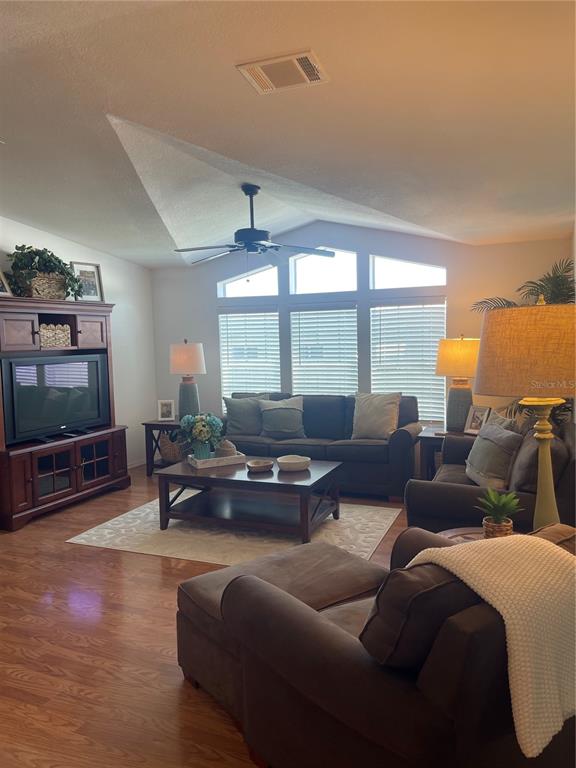 11200 Walsingham Road, Unit 139 Largo, FL 33778 - Photo 3 of 13 a living room with furniture and a flat screen tv