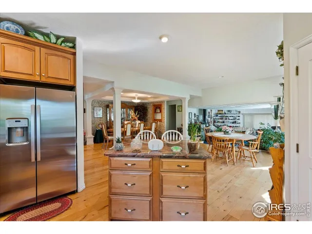 a kitchen with a refrigerator and cabinets