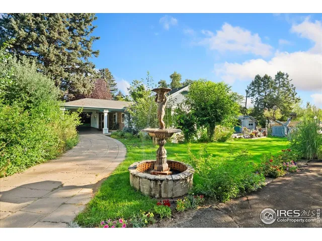 a swimming pool with outdoor seating and yard