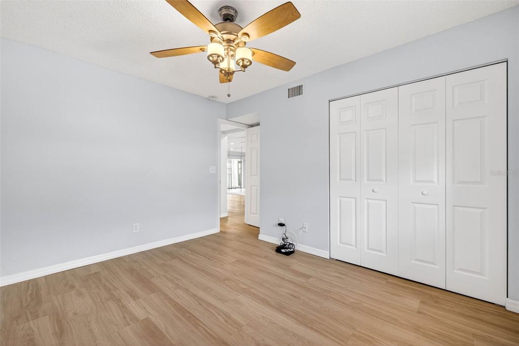 5197 Silent Loop, Unit 124 New Port Richey, FL 34652 - Photo 27 of 55 a view of an empty room with wooden floor