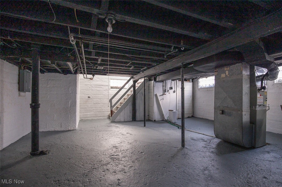 1604 Hampton Road Akron, OH 44305 - Photo 30 of 30 Below grade area with heating unit, electric panel, and stairway