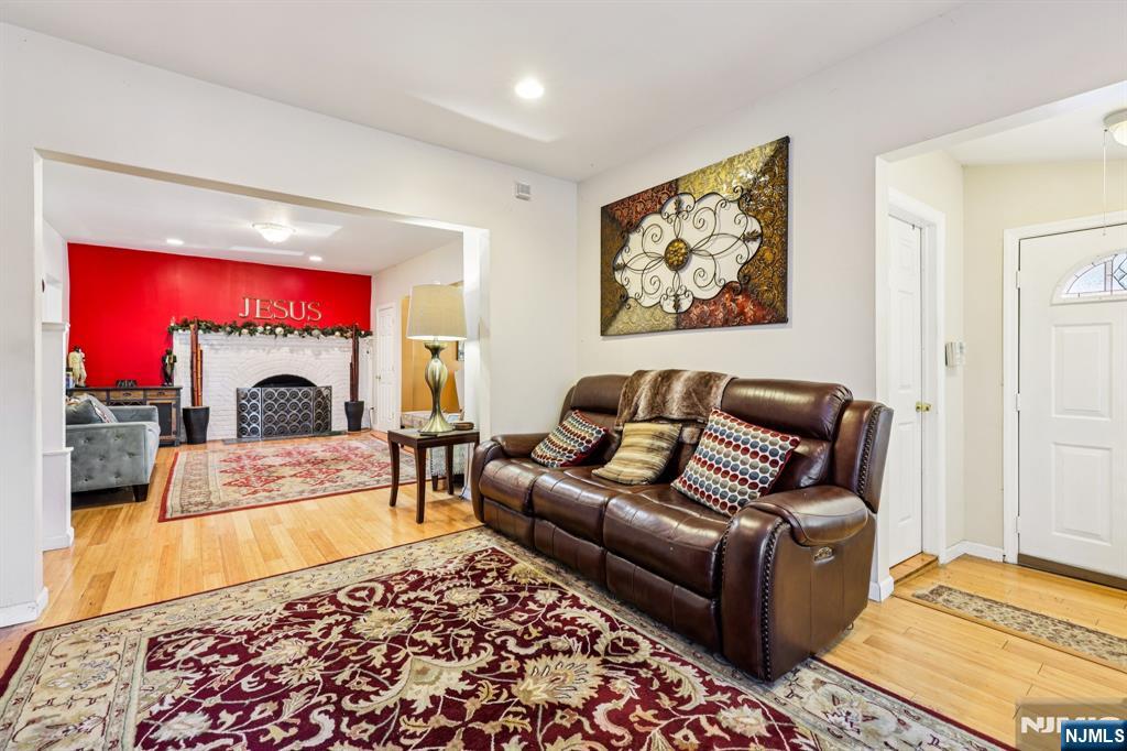 28 Scheerer Avenue Newark, NJ 07112 - Photo 11 of 39 a living room with furniture and a fireplace