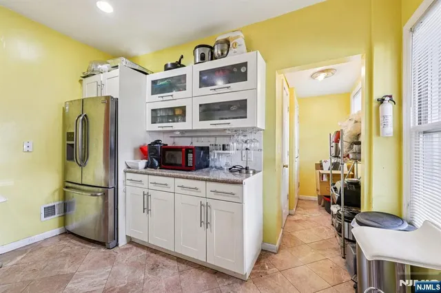 a bathroom with a toilet a sink and shower