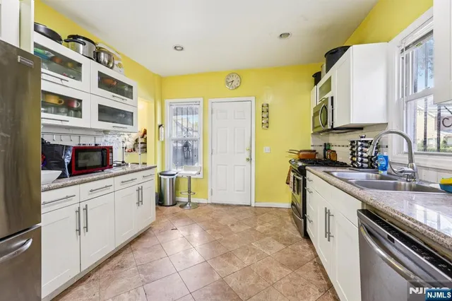 a bathroom with a toilet a sink and shower