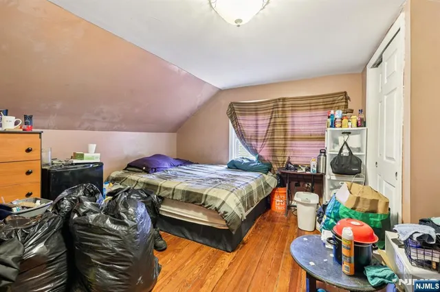 a bedroom with a bed and a walk in closet