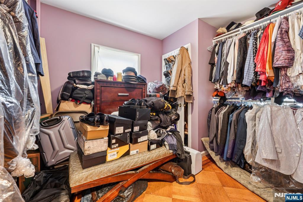 28 Scheerer Avenue Newark, NJ 07112 - Photo 24 of 39 a view of walk in closet with clothes and shoes