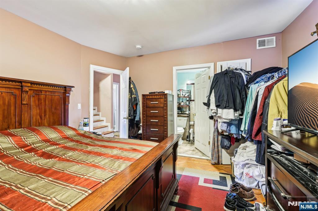 28 Scheerer Avenue Newark, NJ 07112 - Photo 32 of 39 a bedroom with a bed and a walk in closet