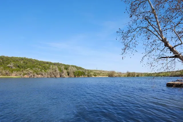 a view of lake with mountain in the background