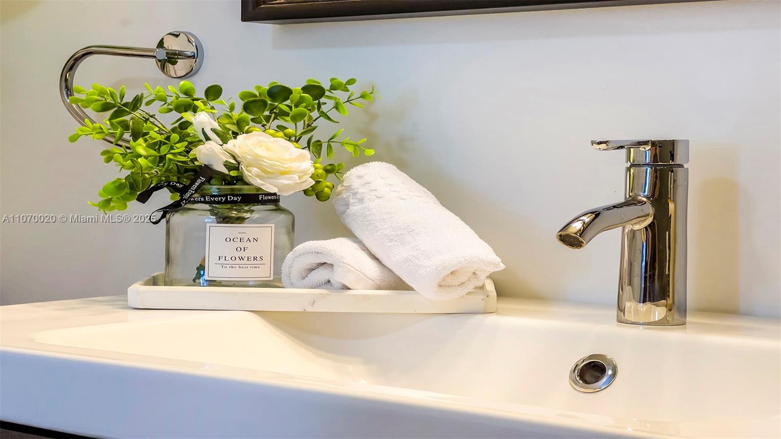 2301 Collins Avenue, Unit 301 Miami Beach, FL 33139 - Photo 18 of 19 a bathroom view a mirror