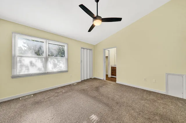 a view of empty room with windows