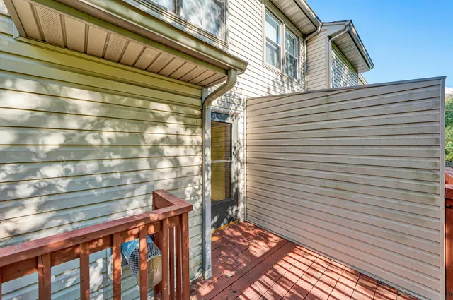 a view of a balcony with wooden floor