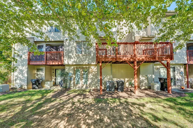 a front view of a house with a lake view