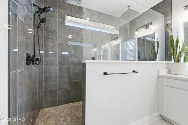 a view of a patio with couches and potted plants