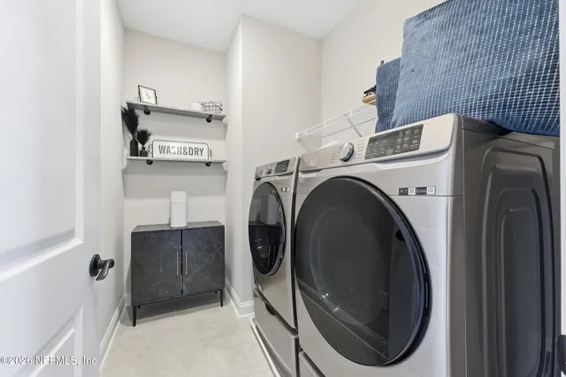 a front view of a building with a garden