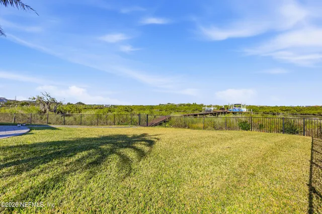 an aerial view of a house with a ocean view