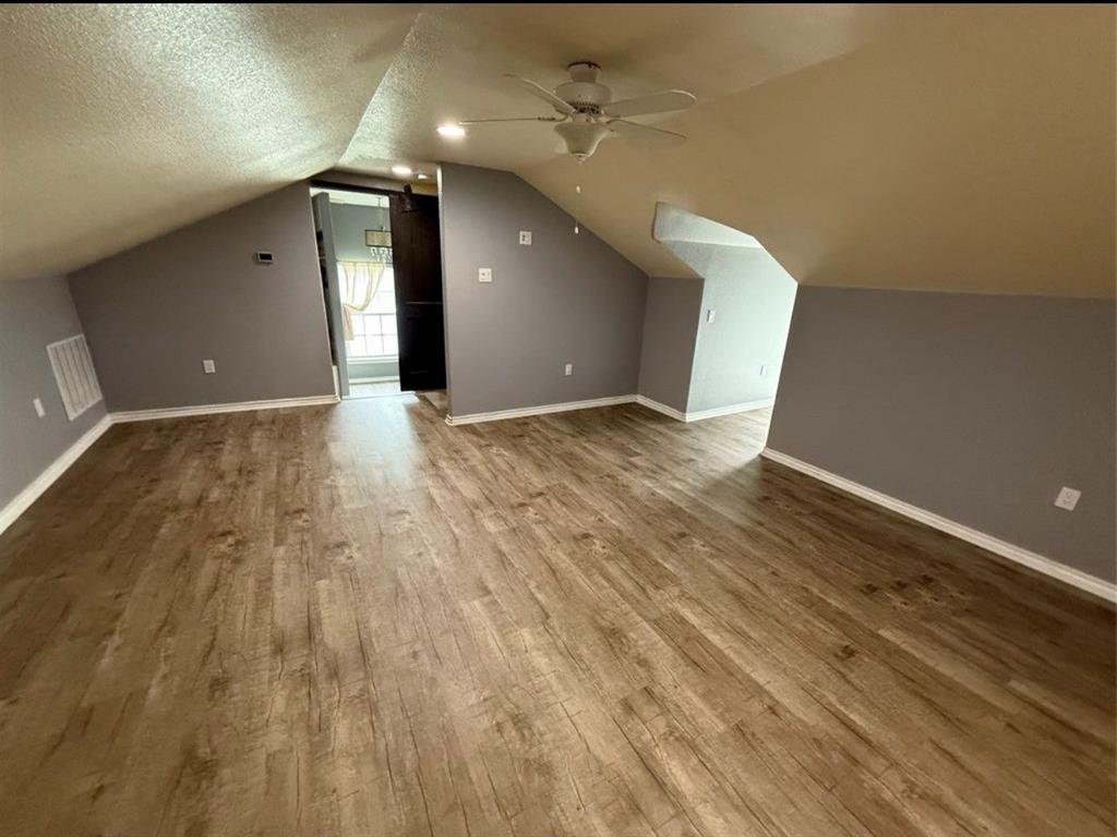 400 North Ave A Springtown, TX 76082 - Photo 18 of 19 an empty room with wooden floor and windows