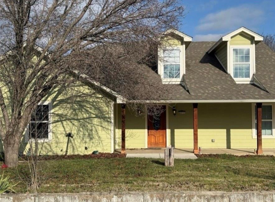 400 North Ave A Springtown, TX 76082 - Photo 2 of 19 a front view of a house with a yard