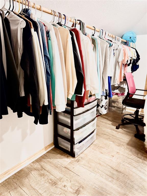 400 North Ave A Springtown, TX 76082 - Photo 6 of 19 a view of walk in closet with clothes and shoes