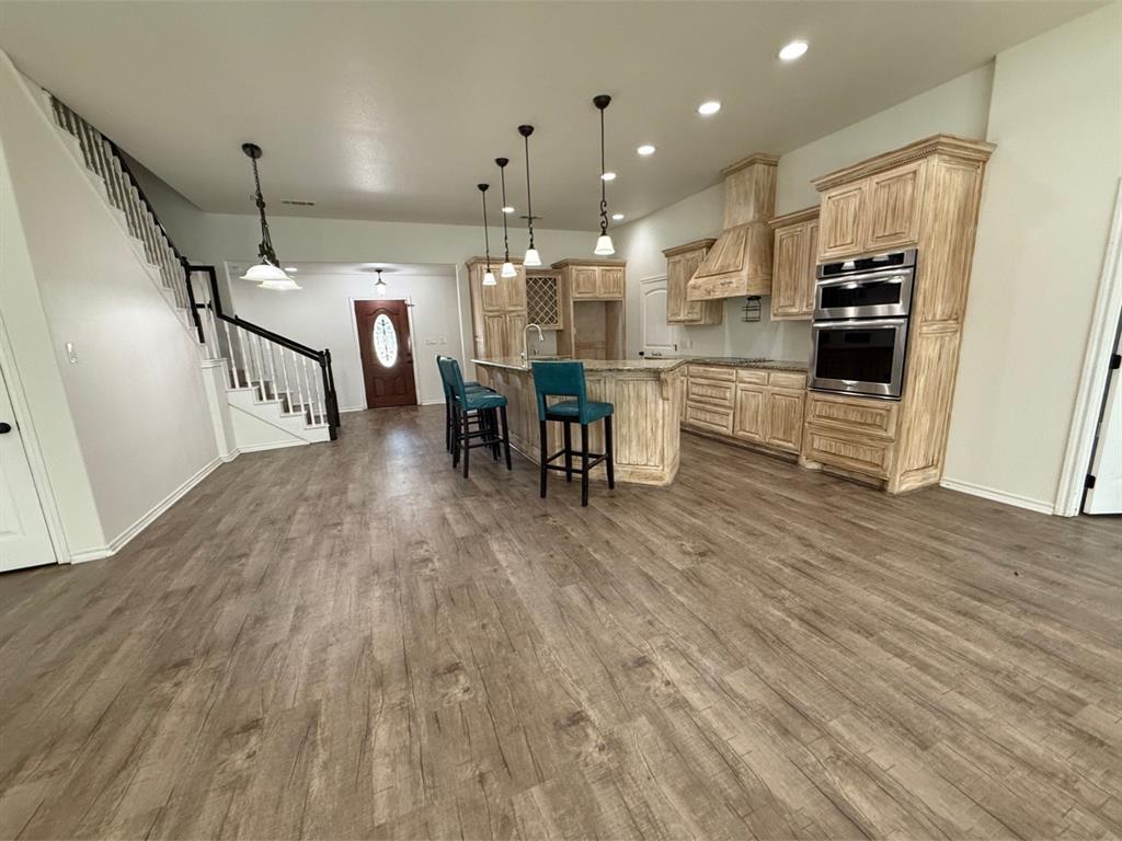 400 North Ave A Springtown, TX 76082 - Photo 10 of 19 a open kitchen with white cabinets and stainless steel appliances