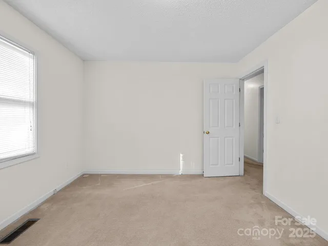 an empty room with a natural light