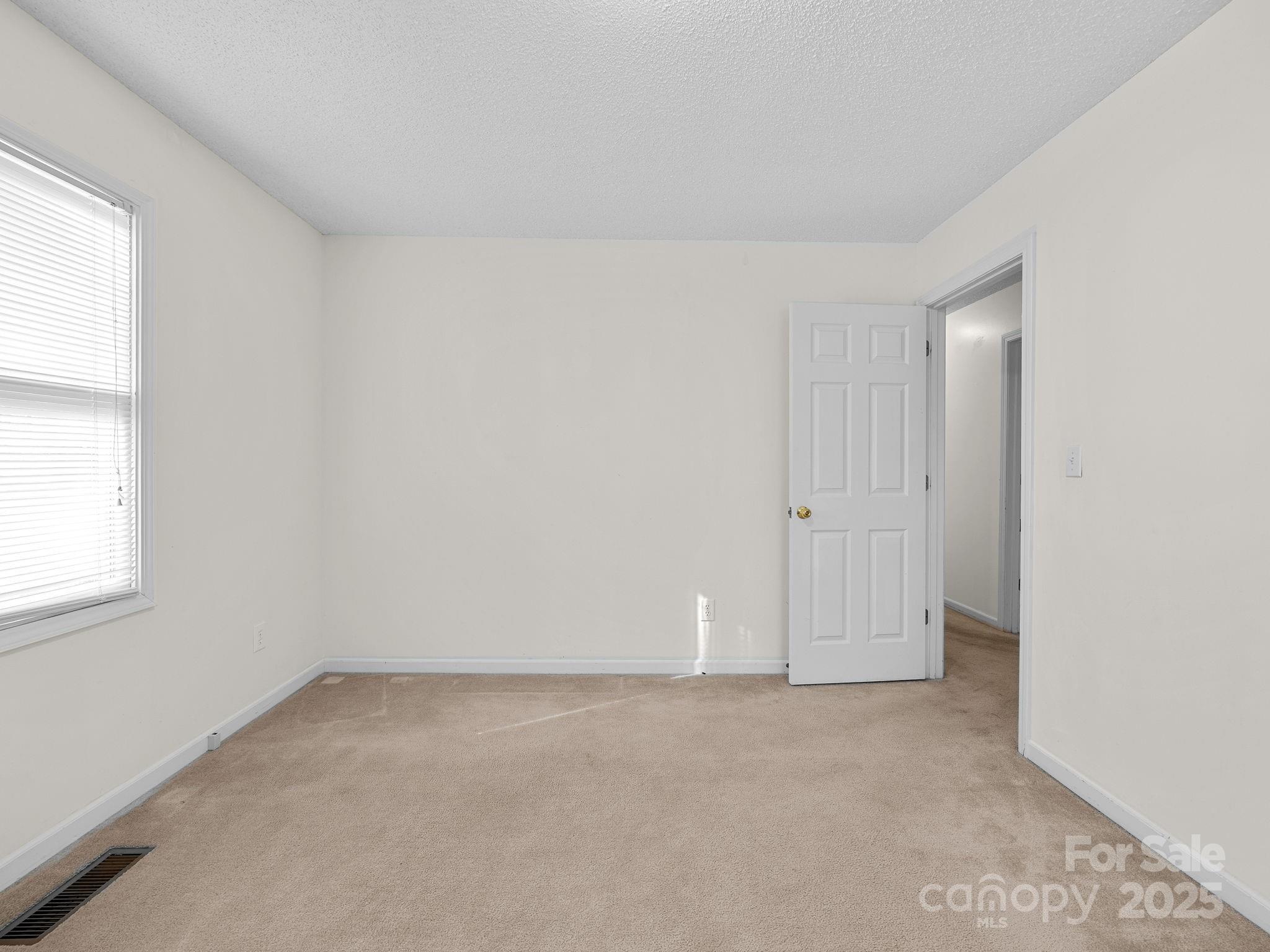 383 Woody Circle Tryon, NC 28782 - Photo 24 of 36 an empty room with a natural light