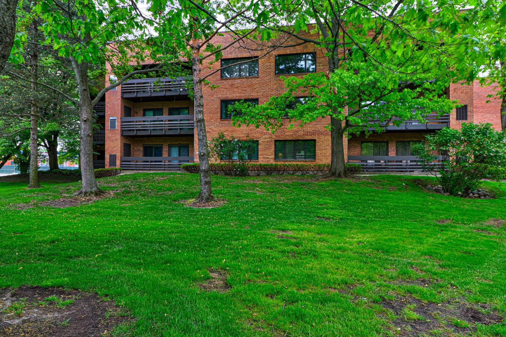 1088 Shermer Road, Unit 308 Northbrook, IL 60062 - Photo 3 of 25 a front view of house with yard and green space
