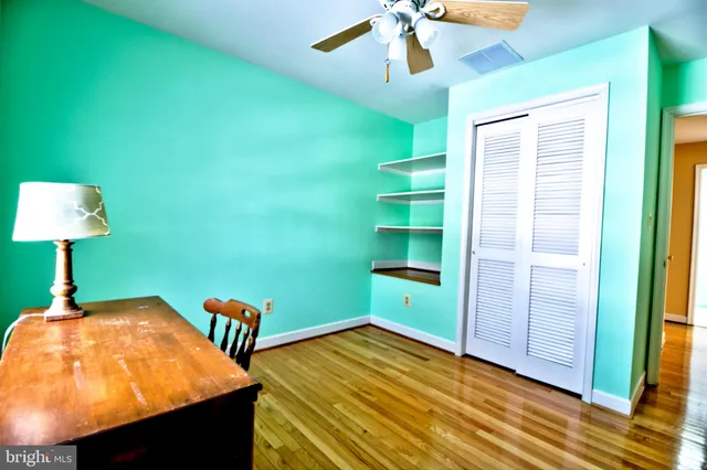 a room with pool table and a chandelier