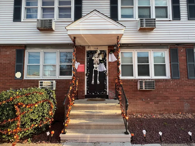 a front view of a building with a porch