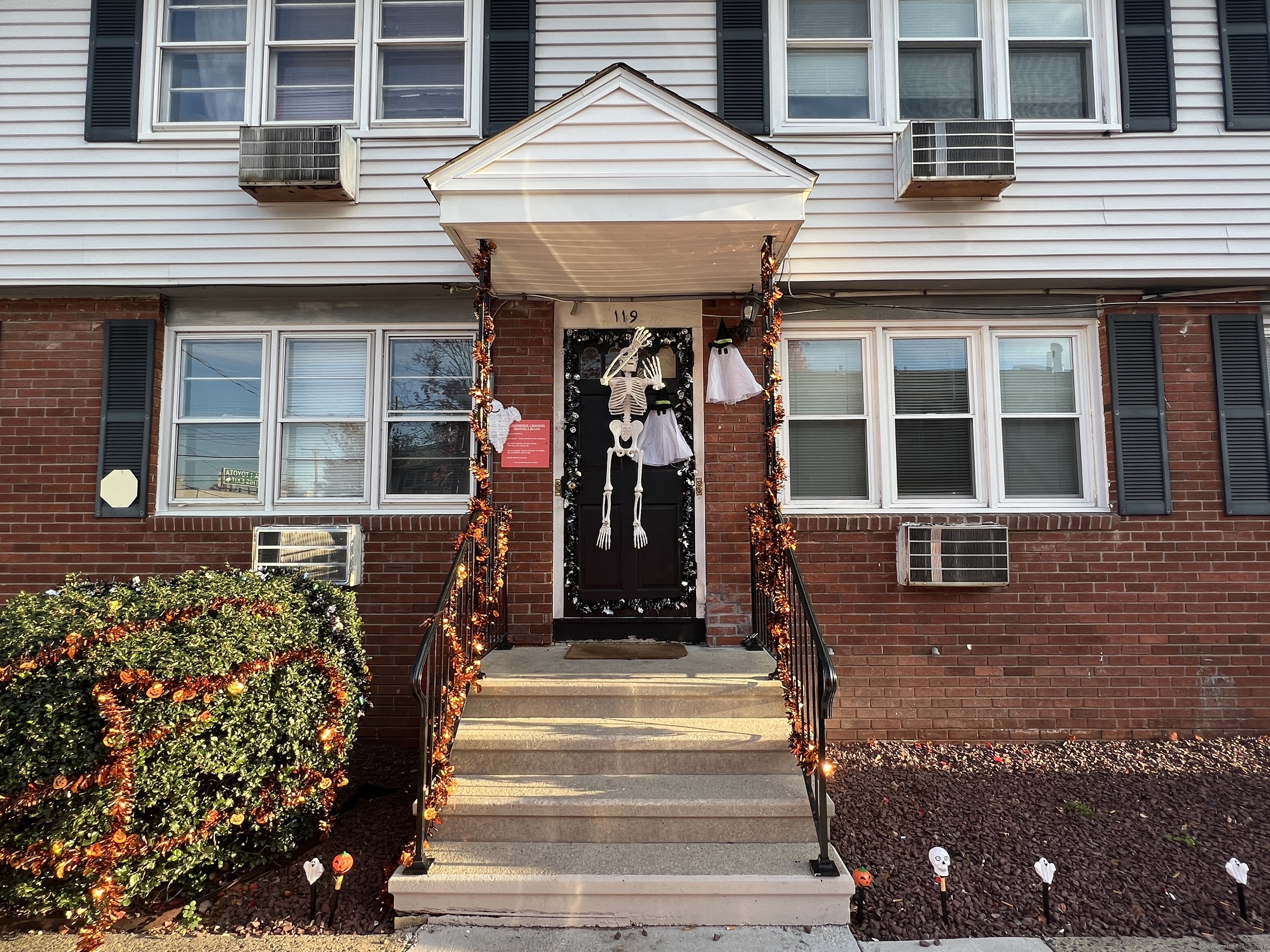 a front view of a building with a porch