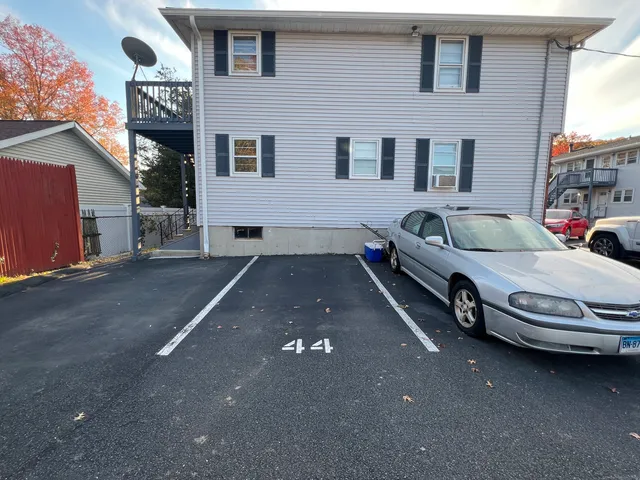 a view of a car in front of a building